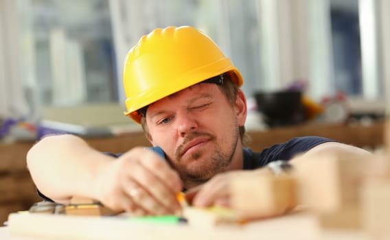 Arms of worker measuring wooden bar portrait. Manual job DIY inspiration improvement job fix shop yellow helmet joinery startup workplace idea hard hat career ruler industrial education