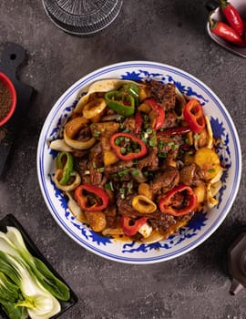 noodles with bell pepper, potatoes, meat and herbs