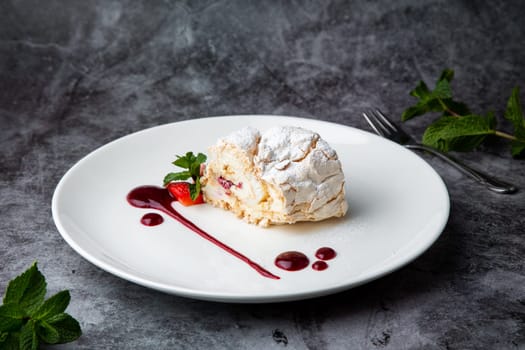 sweet sponge dessert with raspberries and powdered sugar