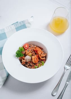 buckwheat with seafood, oyster, tomato and herbs