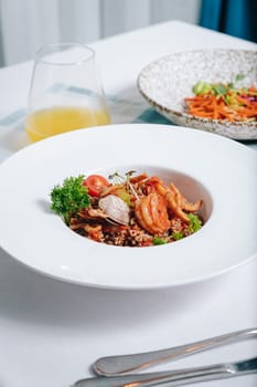 buckwheat with seafood, oyster, tomato and herbs