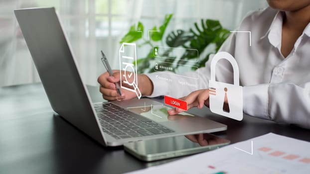 Businesswoman using computer to login represents protection concept of cyber security and data security including secure login.