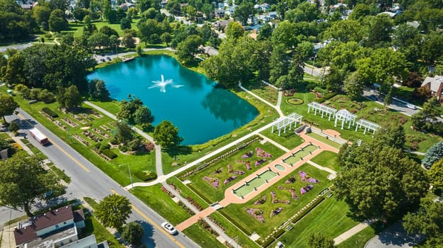 Image of Aerial Lakeside Park with lake and giant fountain beside ideal outdoor wedding location with gardens