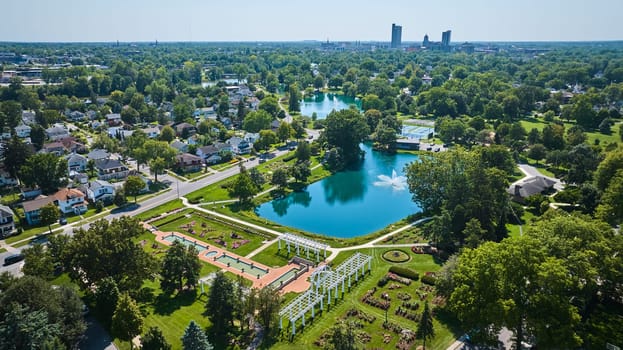 Image of Aerial Lakeside Park gardens and fountains with distant downtown Fort Wayne