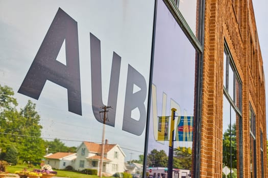 Image of Close up view of ACD Automobile Museum window with Auburn decal