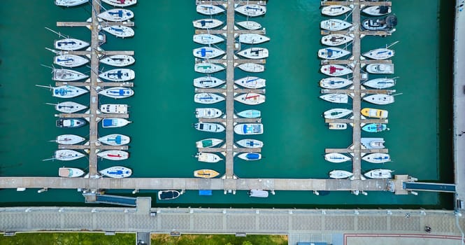 Image of Aerial downward view of boats and yachts on pretty blue water at South Beach Harbor