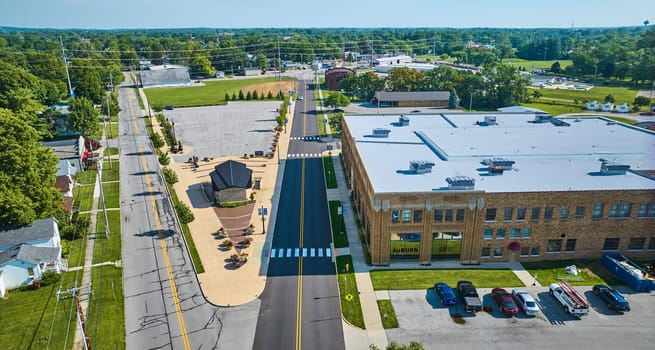 Image of Side view of ACD Automobile Museum with parking lots on bright sunny day aerial