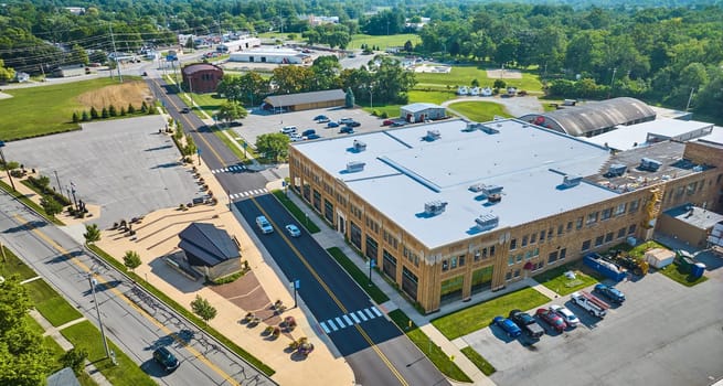 Image of ACD Automobile Museum entrance with parking lots on bright sunny day aerial