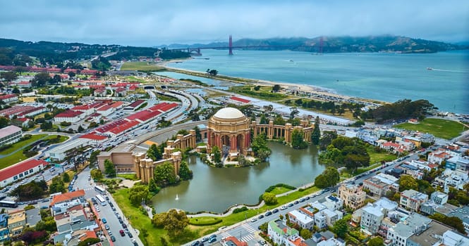 Image of Open air rotunda Palace of Fine Arts wide aerial colonnade around pond in city Marina District