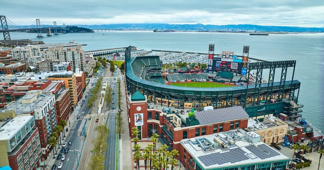 Image of Aerial Oracle Park ballpark with Oakland Bay Bridge and South Beach Harbor