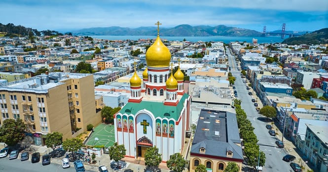 Image of Aerial of Russian Holy Virgin Cathedral with city leading to Golden Gate Bridge in background