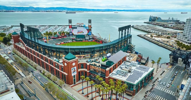 Image of Aerial Oracle Park Willie Mays Gate entrance with ballpark and South Beach Harbor