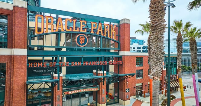 Image of Aerial Oracle Park Willie Mays Gate ballpark entrance with palm trees and sign