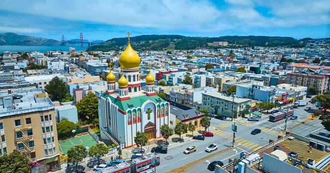 Image of Gorgeous aerial of Holy Virgin Cathedral with Golden Gate Bridge in background