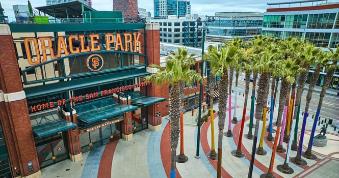 Image of Aerial Willie Mays Gate Oracle Park front entrance with statue and palm trees