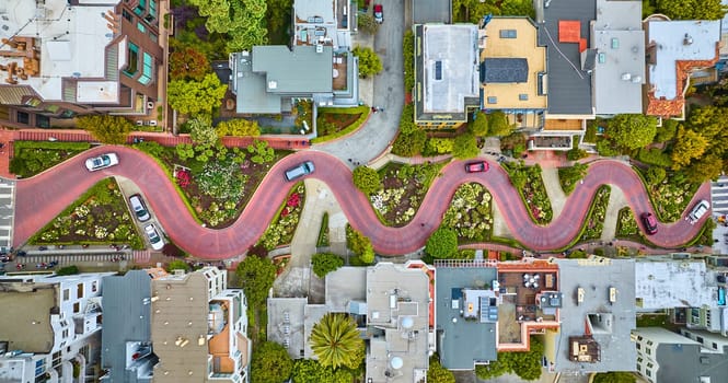 Image of Straight down view Lombard Street with cars driving down red brick road aerial