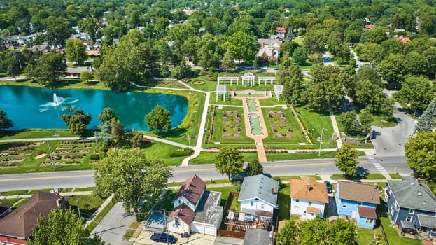 Image of Wide aerial of Lakeside Park with gardens and pond with water fountain