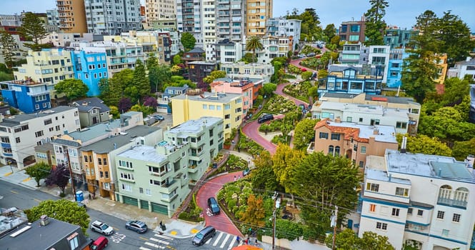 Image of Aerial capturing tilt of Lombard Street as cars wind down with tight view of area