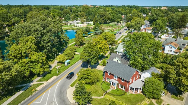 Image of Aerial houses and neighborhood near Lakeside Park with distant view of pergola and gardens