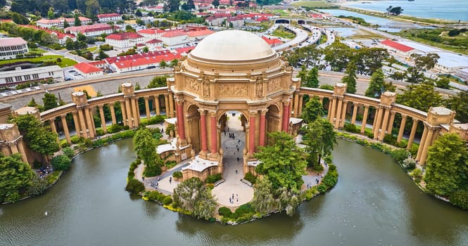 Image of Open air rotunda Palace of Fine Arts aerial colonnade around lagoon in city Marina District