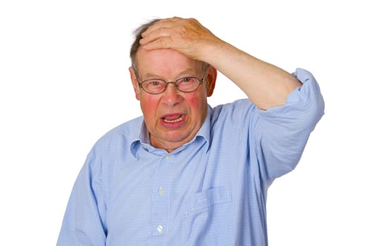 Senior holding hand to his forehead - isolated on white background