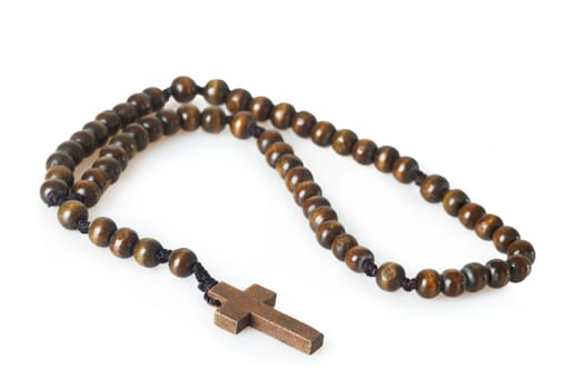 Rosary isolated on light background