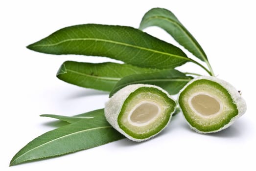 Green raw almonds isolated over a white background.
