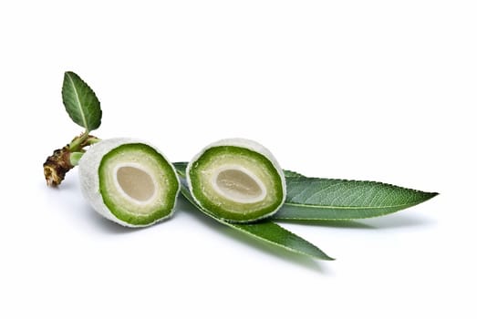 Green raw almonds isolated over a white background.