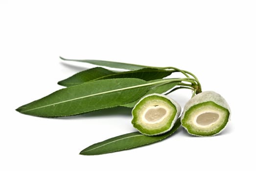 Green raw almonds isolated over a white background.