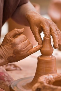 Potter working with clay.