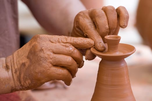 Potter working with clay.