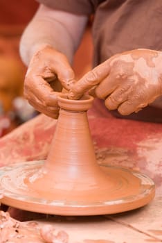 Potter working with clay.