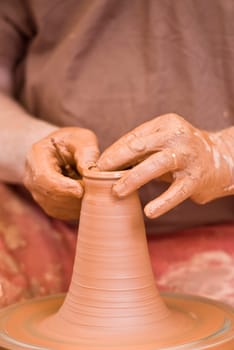 Potter working with clay.