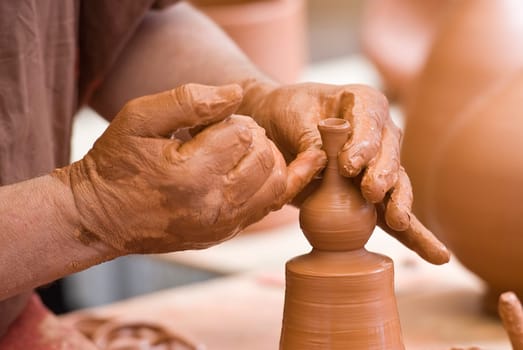 Potter working with clay.