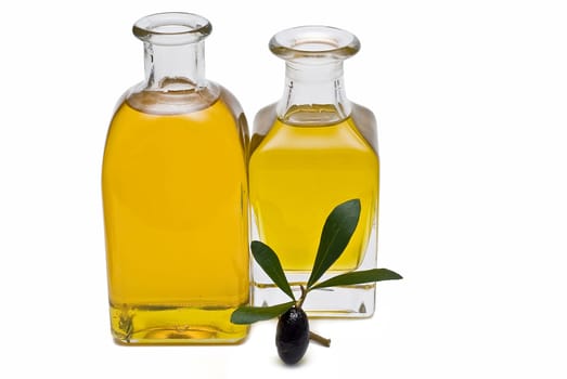 Virgin olive oil and olives isolated on a white background.