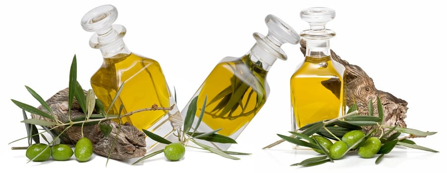 Virgin olive oil and olives isolated on a white background.