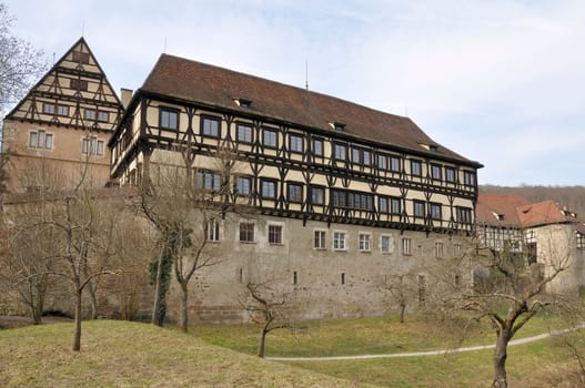 view of famous walled monastery built in medieval times partly with wattle technique, shot from the road in winter light