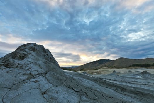 Strange landscape (dry mud, scorched earth) produced bu active mud volcanoes. Location: Romania, Buzau county