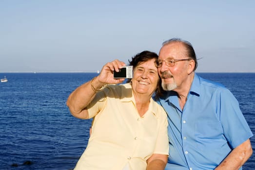 happy senior couple on summer vacation