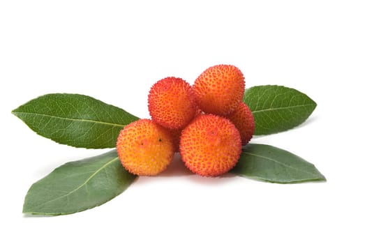 Fresh arbutus fruits isolated over a white background.
