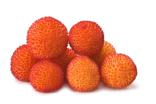 Fresh arbutus fruits isolated over a white background.