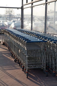 Row of empty shopping carts at the supermarket