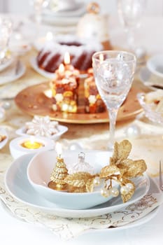 Place setting for Christmas in golden and white tone