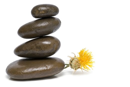 Boulders in zen balance over a white background.