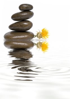 Boulders in zen balance over a white background.