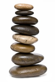 Boulders in zen balance over a white background.