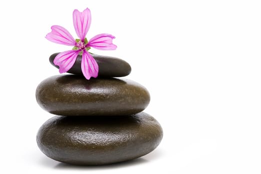 Boulders in zen balance over a white background.