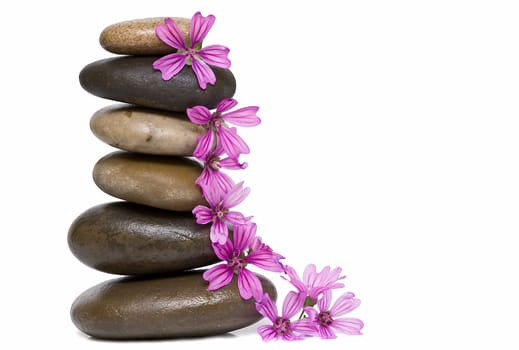 Boulders in zen balance over a white background.