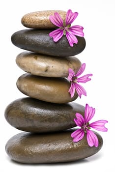Boulders in zen balance over a white background.