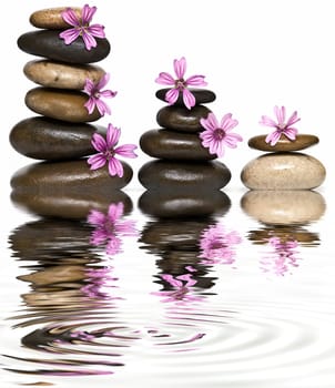 Boulders in zen balance over a white background.